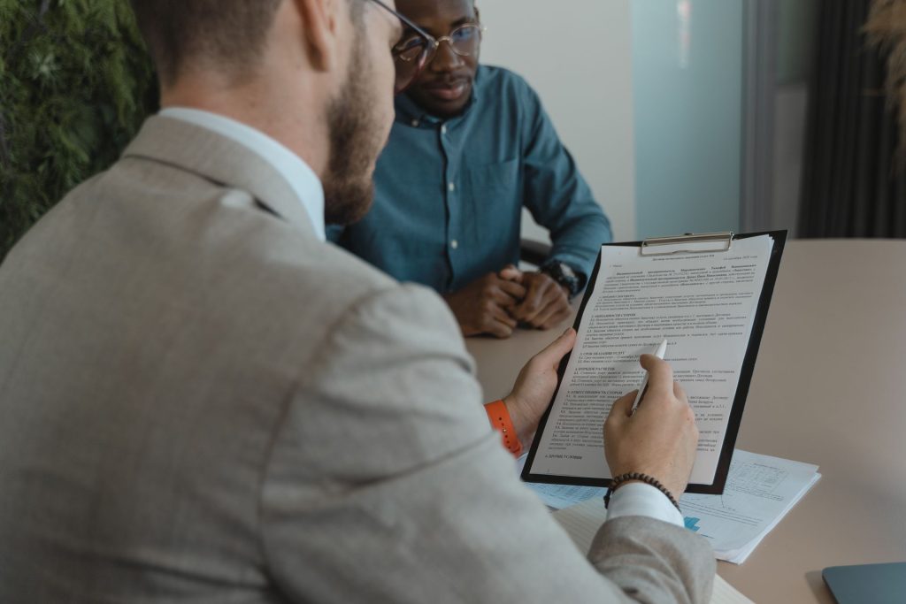 Recruiter reviewing a printed resume with a candidate